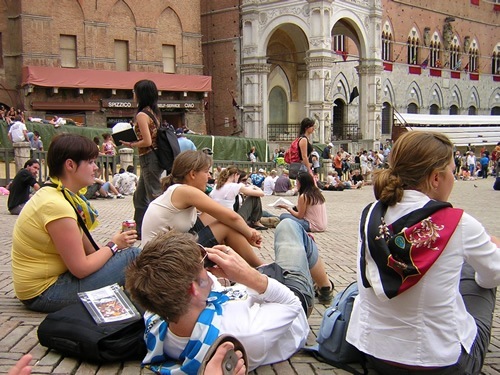 Interns relaxing at Palio in Siena, Italy